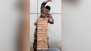 Military officer breaks 14 bricks using his hand