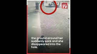 CCTV footage shows woman being swallowed by sinkhole while walking