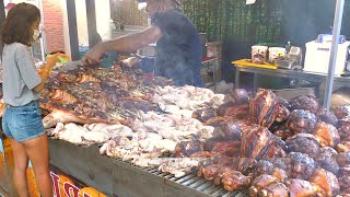 Italy Street Food. Biggest Whole Bull Roasted, Pork Knuckles, Mixed Meat on Grill, Sausages