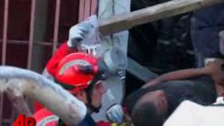 Rescuers Pull Haitian Man From Deep Under Rubble