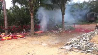 Firecrackers at new ancestor home in Hainan(longgun village)