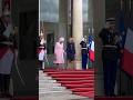 French President's wife holds Queen Camilla's hand | HELLO!