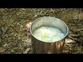 trangia alcohol stove and zebra loop handle pot cooking sliced rice cake soup