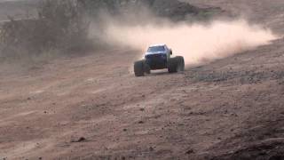 RedCat Rampage XT 1/5th Scale Gasoline RC 4WD Monster truck tearing the Dirt road.