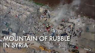 Drone footage shows mountain of rubble in Syria's Sarmada after powerful earthquake