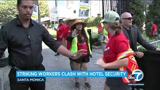 Striking hotel workers clash with security guards while picketing in Santa Monica