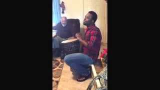 Togolese man shows American father-in-law the djembe.