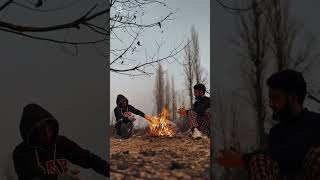 Relaxing by the Campfire: Two Friends in Nature