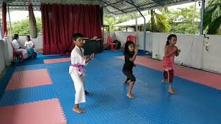 Young karate champs of Rei institute of martial arts practising kihon