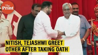 Bihar CM Nitish Kumar, Deputy CM Tejashwi Yadav greet each other after oath-taking ceremony in Patna