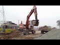 transporting heavy equipment doosan 100w excavator digging gravel loading dumptruck