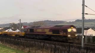 Dirty ex-EWS DB cargo class 66 passes Stirling bridge on an engineering train