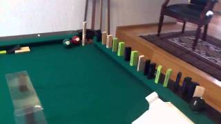 Pool trick shots with domino