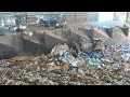 garbage trucks dumping at transfer station