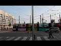 new ttc streetcar on route 509 with pantograph up at queens quay and spadina