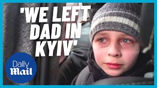 Ukrainian boy in tears as he escapes to border: 'We left dad in Kyiv'
