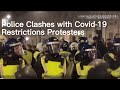 London police clash with demonstrators protesting over COVID-19 restrictions while Omicron surging