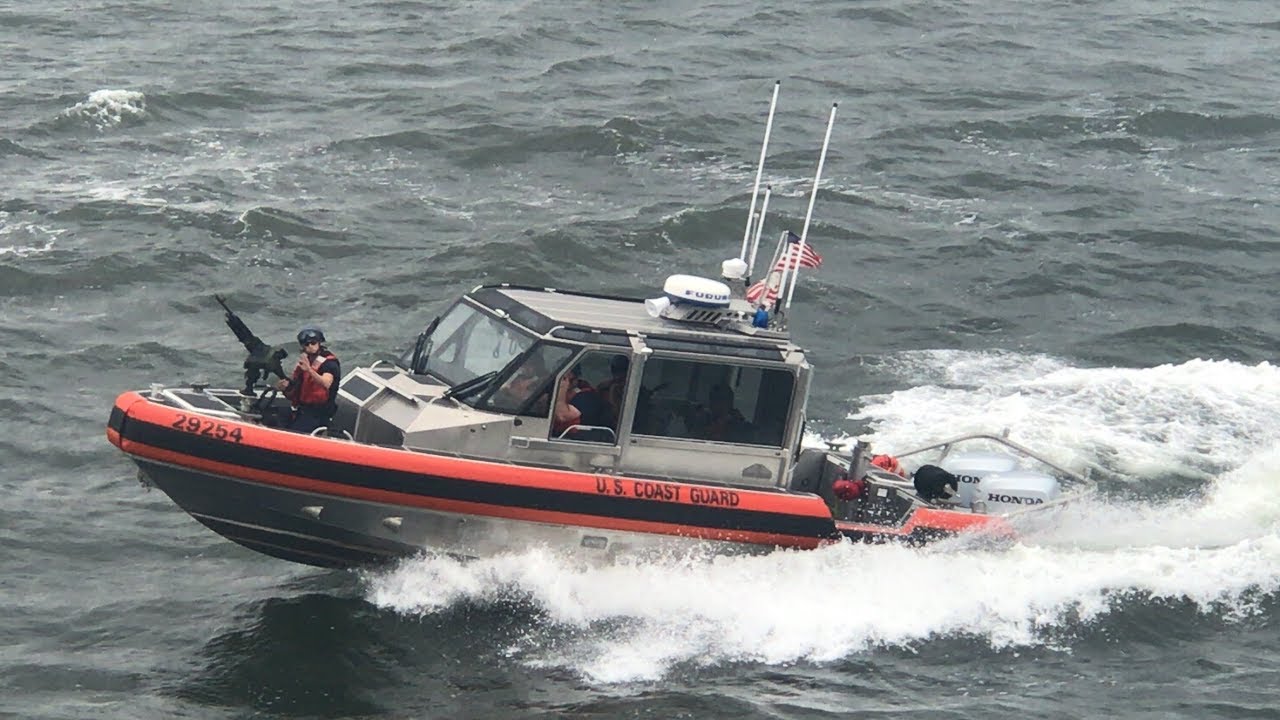 Armed United States Coast Guard Boat Escorting The Staten Island Ferry ...