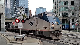 Metra SD70MACH 505 east meets Amtrak P42 152 west in Chicago on November 13, 2024