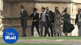 Cara Delevingne wears a suit at pal Eugenie's royal wedding