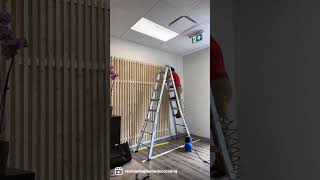 Waiting room makeover with a DIY wood slats wall!!