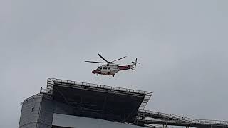 Coastguard rescue helicopter coming into land at QEUH Glasgow