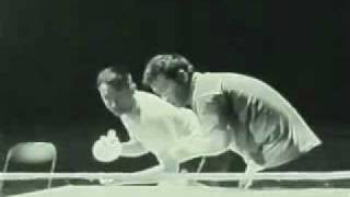 Bruce Lee hitting ping pong with nunchucks