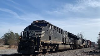 NS 243 coming up by CP Cottage in Carlise, with CSX M583-09 passing in the background