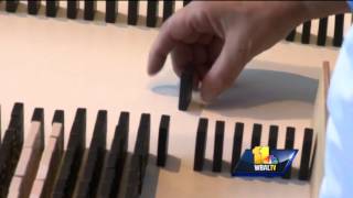 Domino exhibit demonstrates physics at science center