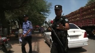 Riots in China's Xinjiang region kill dozens