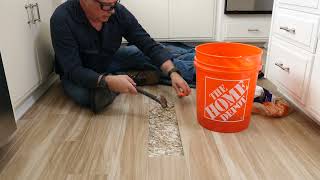 Fixing a subcontractor's  mistake! How to repair a broken floor tile on concrete.