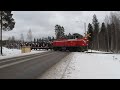 freight train full of tractors passed level crossing near valtra factory in suolahti finland