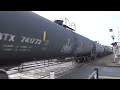 northbound bnsf mixed freight train passes through the mccarver street railroad crossing.