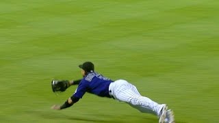 Gonzalez makes a diving grab to rob Kozma