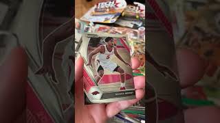 A Moses Moody NBA Golden State Warriors Arizona Razorbacks Rookie Trading Card by Panini. Champion.