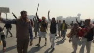 Defiant farmers blockade highways to New Delhi