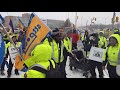 Striking Canada Post workers rally outside management headquarters