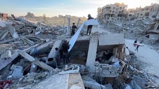 Palestinian man returns to home in Gaza's Jabaliya refugee camp to find area turned to rubble