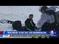 two snowmobilers rescued after being caught in avalanche