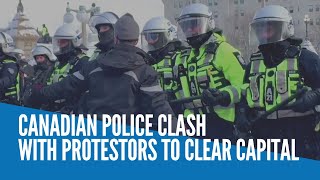 Canadian police clash with protestors to clear capital