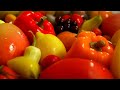 a colourful mix of fresh fruits veggies and sweet treats on a plate