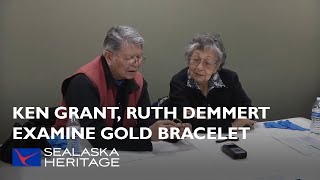 Tlingit Elders Ken Grant, Ruth Demmert Examine Gold Amos Wallace Bracelet