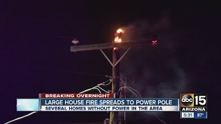 Large house fire spreads to power pole, several homes without power Sunday morning