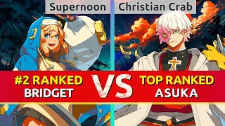 GGST ▰ Supernoon (#2 Ranked Bridget) vs Christian Crab (TOP Ranked Asuka). High Level Gameplay