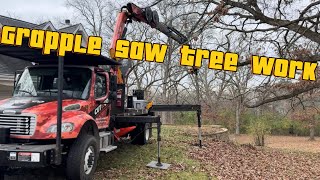 Tree work with grapple saw truck