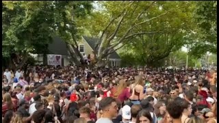 Crowd gets out of control at McMaster University's homecoming, flipping cars, and damaging property