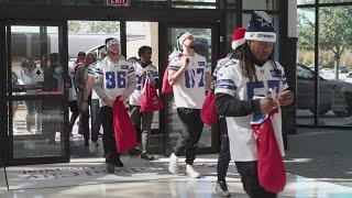 Dallas Cowboys visit patients at local hospitals getting treatment this holiday season