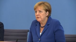 Merkel defends refugee stance after attacks