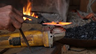 Turning a hand grinder blade ~ blacksmith