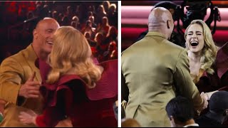 Adele meeting The Rock first time at the #grammys and She got up and gave him a hug/kiss
